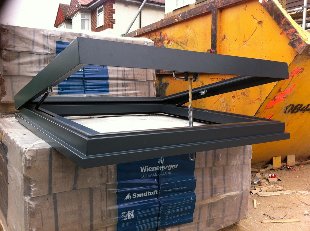 Opening flat roof skylight in anthracite grey installed in Newport Pagnell